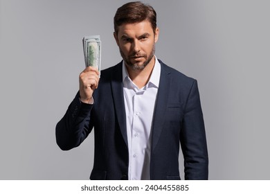 Man with money cash. Dollar banknotes. Portrait of man holding bunch of money banknotes. Dollar bills, credit, online banking. Rich man with dollar banknotes, bank loan, financial savings.