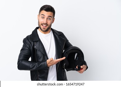 Man With A Motorcycle Helmet Extending Hands To The Side For Inviting To Come