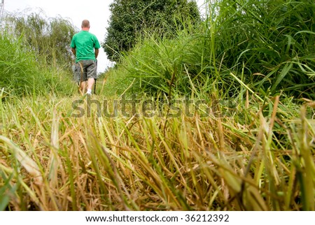 Man Mowing Grass