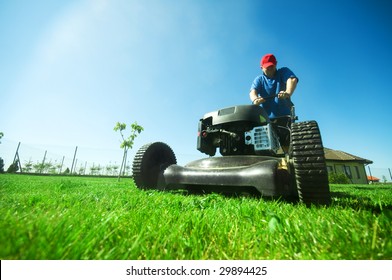 Man mowing the lawn. Gardening