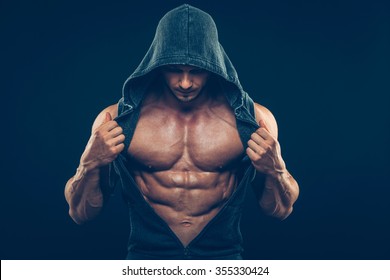 Man With Muscular Torso. Strong Athletic Man Fitness Model Torso Showing Six Pack Abs