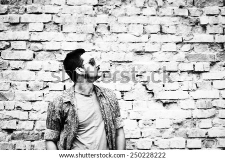 Similar – Man with sun hat and sunglasses on an old bridge