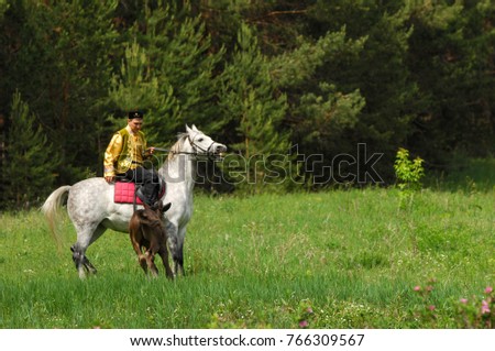 A man in a national costume, Tatar. The man on horseback. Sabantuy National Day