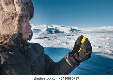 Man navigating in winter lnadscape