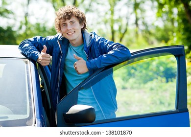 man near blue car - Shutterstock ID 138101870