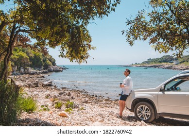 Man Near White Suv Car At Summer Sea Beach