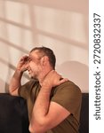 Man with neck, muscle, back and sciatica pain at home.