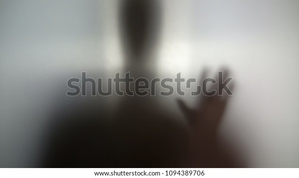 Man needs help, drug addiction, silhouette
behind wall asking for help
anonymity