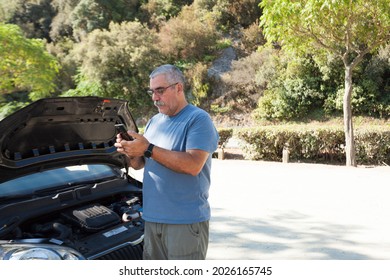 Man Next To Broken Down Car Contacts Roadside Assistance, Help, Breakdown, Heat Wave.