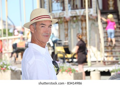 Man next to the carousel
