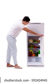 Man Next To Fridge Full Of Food