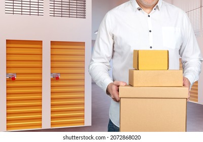 man next to Storage Units. Man with boxes in warehouse corridors. Concept - Rental Storage Units. Warehouse for safekeeping of personal items. Man in front of storage boxes. Warehouse rent - Shutterstock ID 2072868020