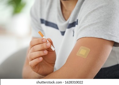 Man With Nicotine Patch And Cigarette, Closeup