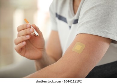 Man With Nicotine Patch And Cigarette, Closeup