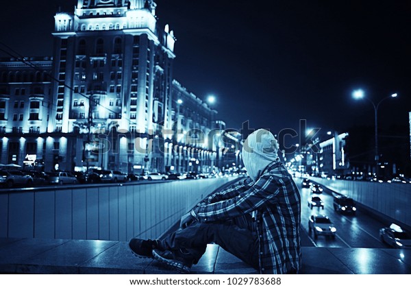 man night city lights, urban\
lonely guy concept, stress, road, car city lights in the\
background