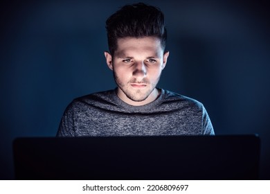 Man At Night In Front Of Laptop Look To Screen With Serious Face While Recognize He Become A Victim Of Scam