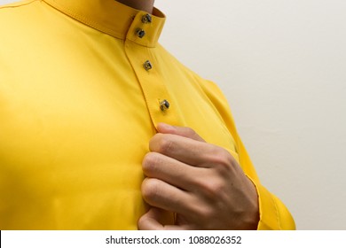 A Man With No Face In Traditional Clothing In Malaysia (Baju Melayu) And Copy Space Isolated With White Background.