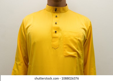 A Man With No Face In Traditional Clothing In Malaysia (Baju Melayu) And Copy Space Isolated With White Background.