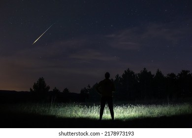 Man observing night sky in nature. - Shutterstock ID 2178973193