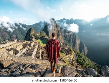 
						Man observing the ruins of Machu Picchu
