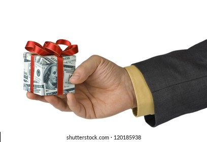 Man offering an expensive gift box wrapped in us dollar bills - Shutterstock ID 120185938