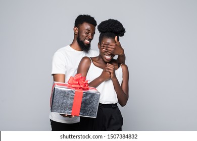 Man Offering Gift To Woman On Her Birthday