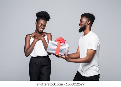 Man Offering Gift To Woman On Her Birthday