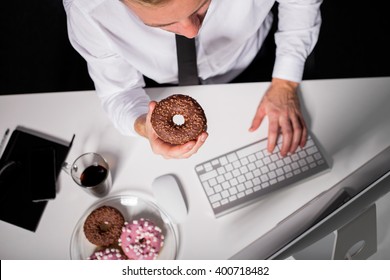 Man At The Office Eating Donuts