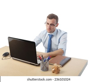 man in office looking at the computer