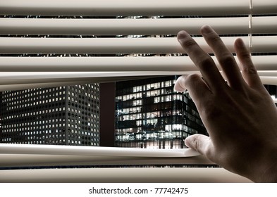 Man At Office Opening Window Blinds And Seeing Business Towers