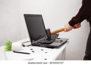 Man Office Worker Smashed A Laptop, Destroyed A Computer. Anger, Hatred, Irritation. Error, Brake, Malfunction, Does Not Want Work. Bad Emotions. Depression, Not Preserved. Nut