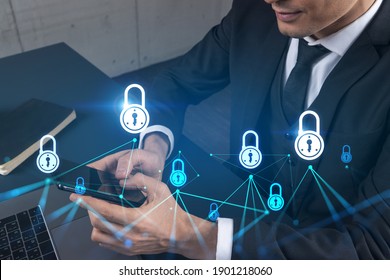 Man in office working with Smartphone, Searching for new technology to protect business information. Lock hologram, typing phone. Double exposure. - Shutterstock ID 1901218060