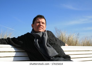 Man On A Bench In Winter