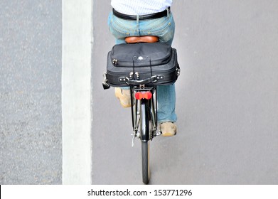 Man On Bicycle On His Way Home From Work, In Bike Lane