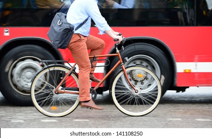 Man On Bike In Traffic