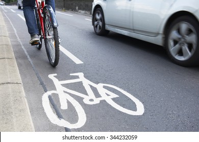 Man On Bike Using Cycle Lane As Traffic Speeds Past