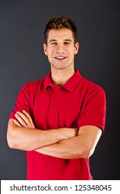 Man On Black Background In Red Shirt With Smile