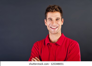 Man On Black Background In Red Shirt With Smile