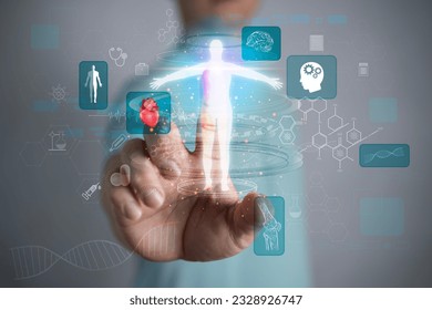 Man on blurred background using digital x-ray human body holographic scan projection 3D rendering. Doctor hand show a hologram of the patient on a blurred background. - Powered by Shutterstock