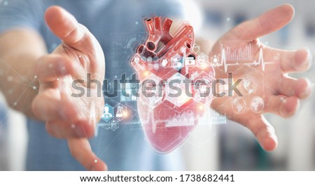 Man on blurred background using digital x-ray of human heart holographic scan projection 3D rendering