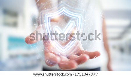 Man on blurred background using digital shield protection blue holographic interface 3D rendering