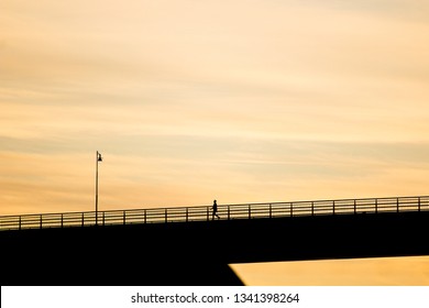 Man On Bridge Silhouette In Sunset