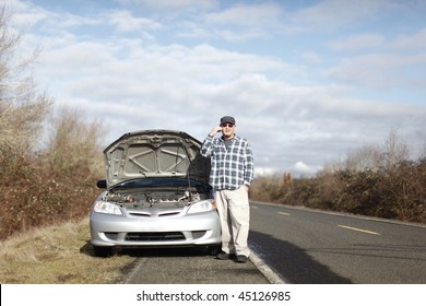 Man On Cellphone With Car Trouble.