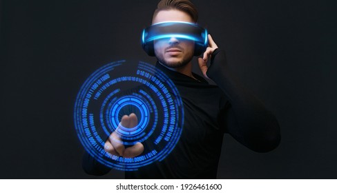 Man on dark virtual reality background. Guy using VR helmet. Augmented reality, future technology, game concept. Blue neon light. Futuristic holographic interface to display data. - Powered by Shutterstock - Get 15% off with code: PIKWIZARD15