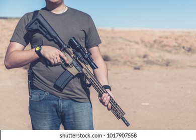 Man On Desert Range Posing With Assault Rifle 