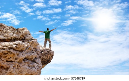 Man On The Edge Of Cliff. Emotional Scene.