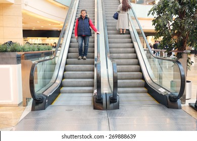 The Man On The Escalator At The Mall