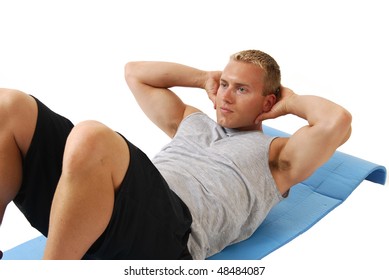 A Man On An Exercise Mat Doing Situps