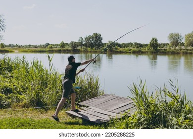 A Man On A Fishing Trip Casts A Rod