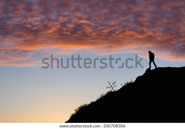 Man on a\
hill